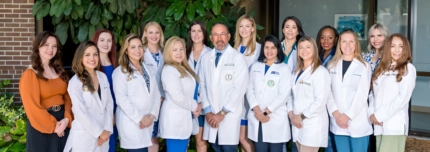 Group of doctors and nurses together for a team photo in a Pediatric Epilepsy & Neurology Specialists Tampa Florida