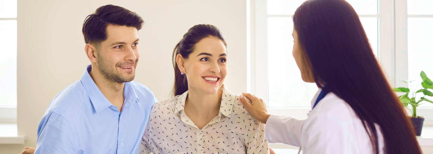 Man and woman consult with a doctor in a medical office at Tampa Florida